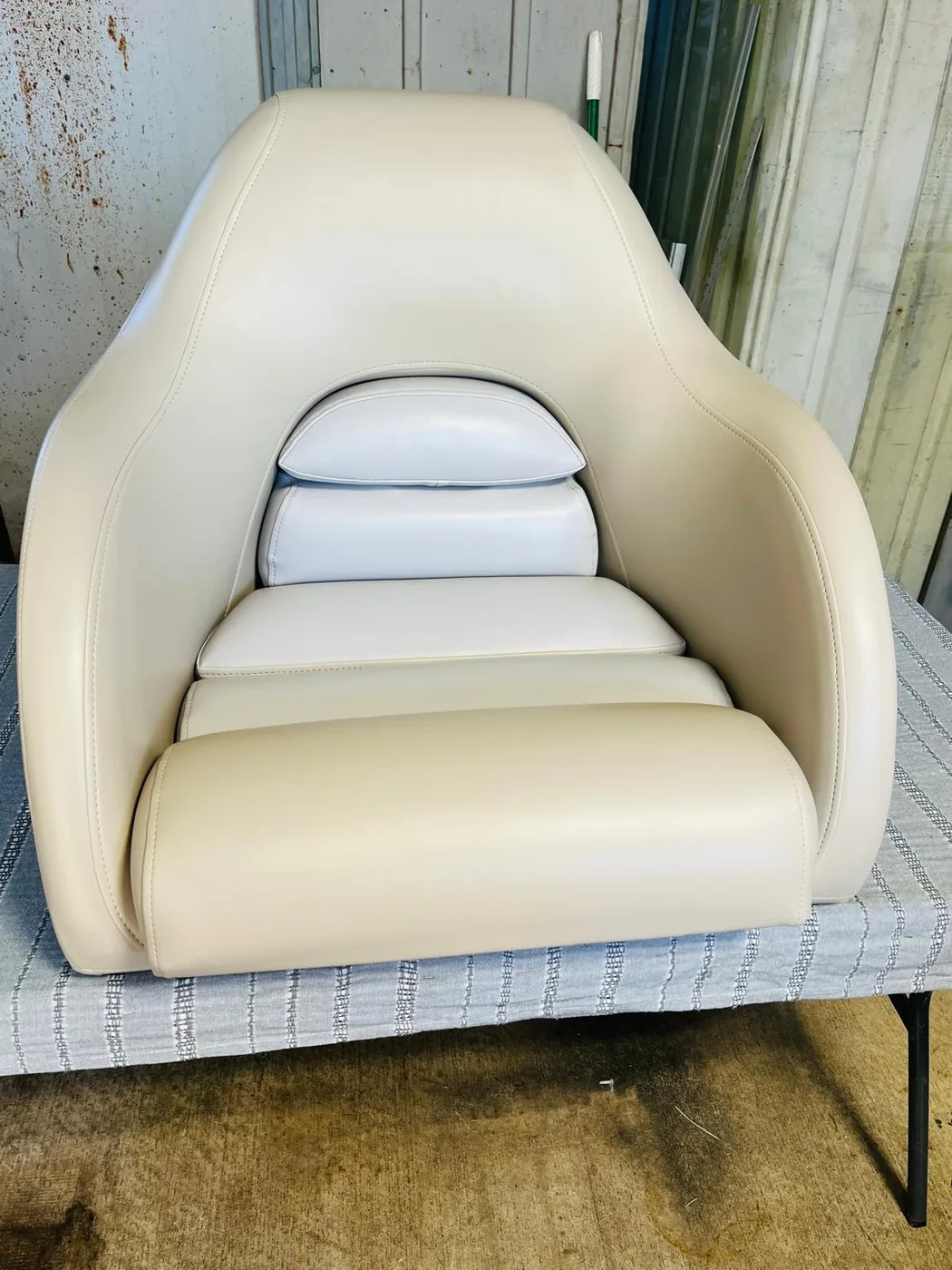Cream captain chair upholstery with headrest and lumbar cushions