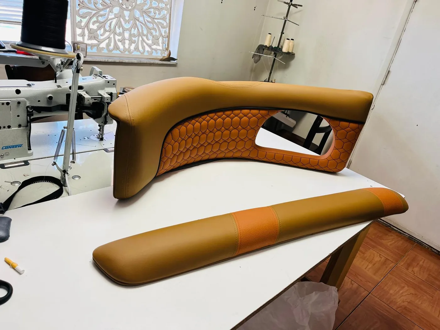 Brown and orange custom marine upholstery panel with honeycomb stitching