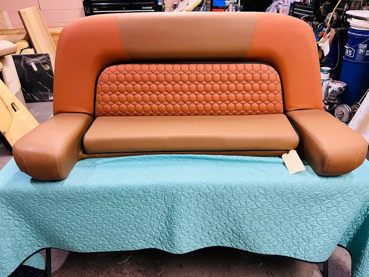 Brown marine bench with honeycomb stitched center panel
