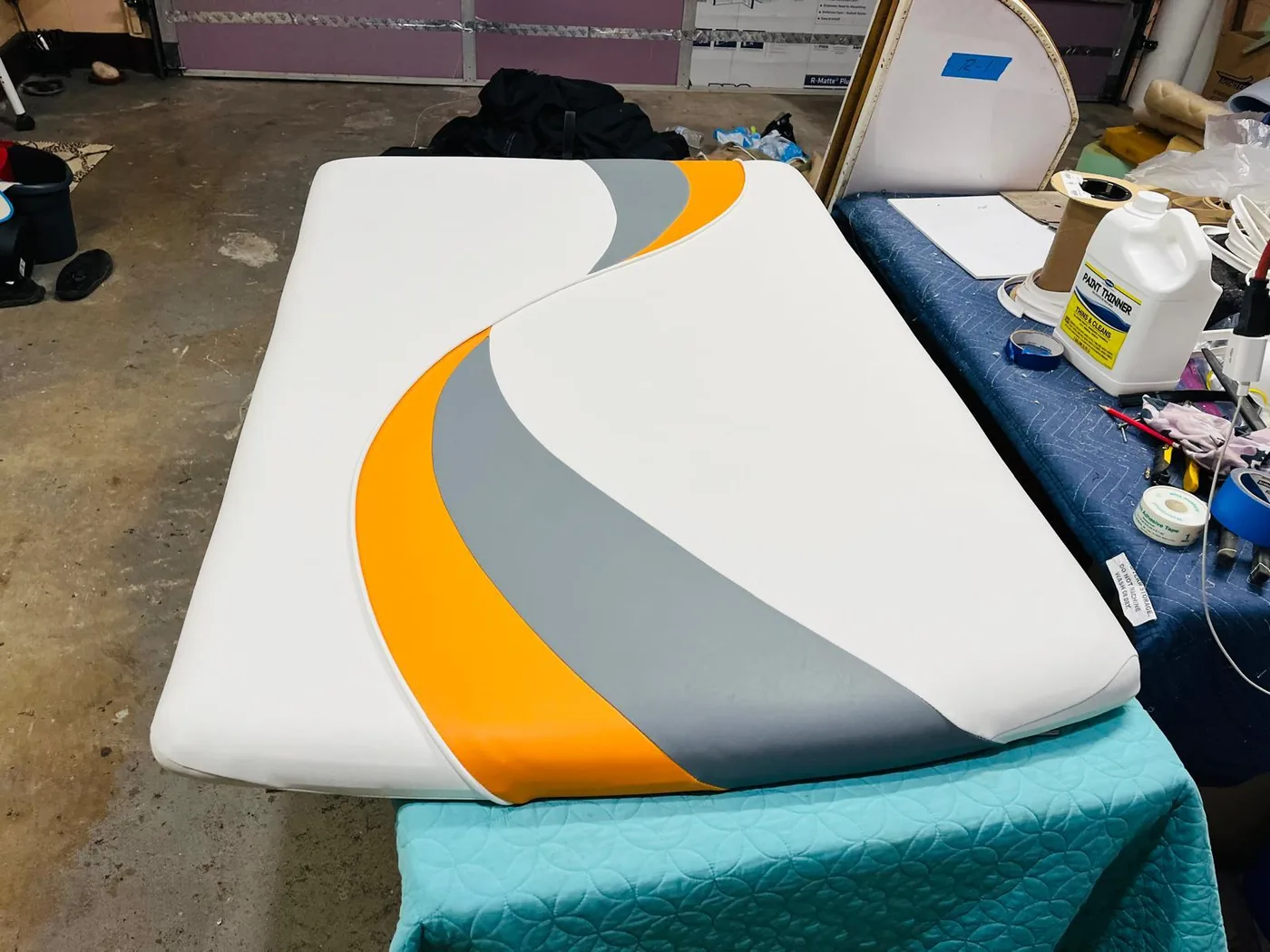 White gray and orange custom boat sun pad upholstery