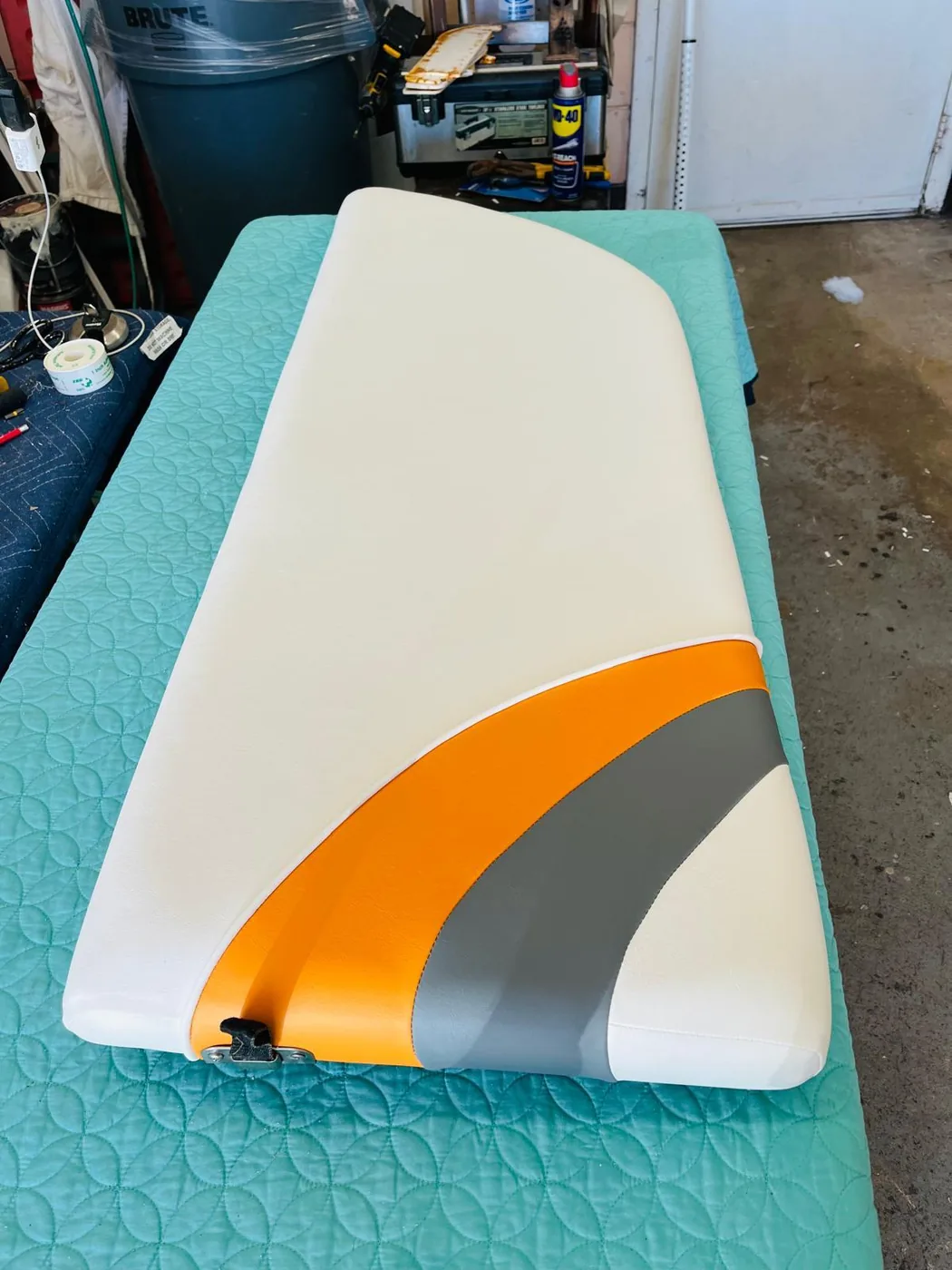 Custom white orange and gray boat pad upholstery close up